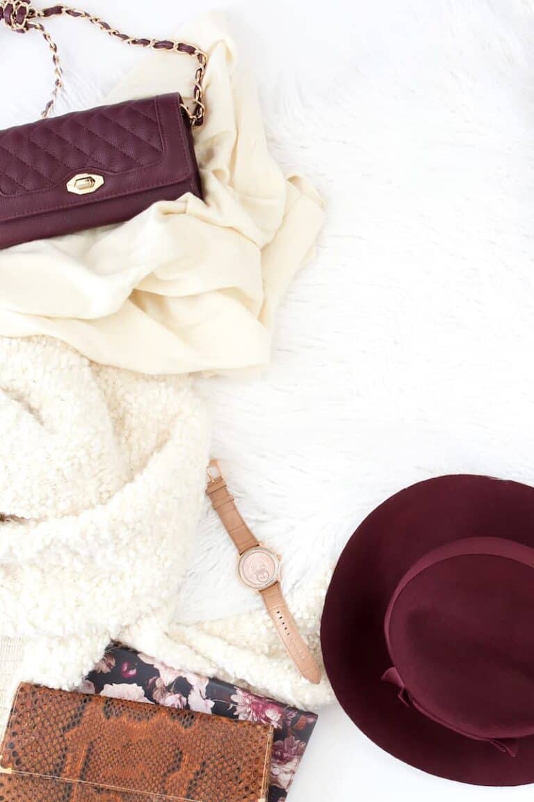 purse scarf hat gloves and watch on white background