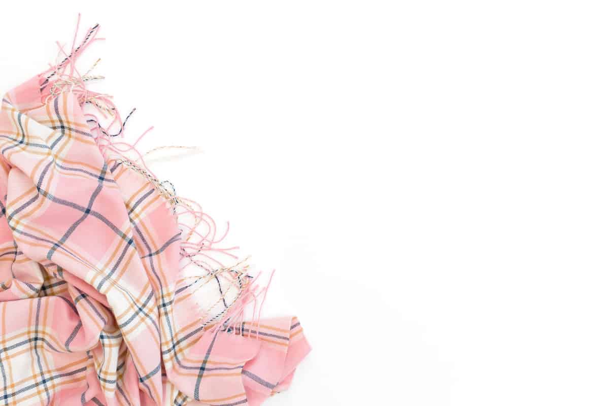 pink plaid scarf on white background