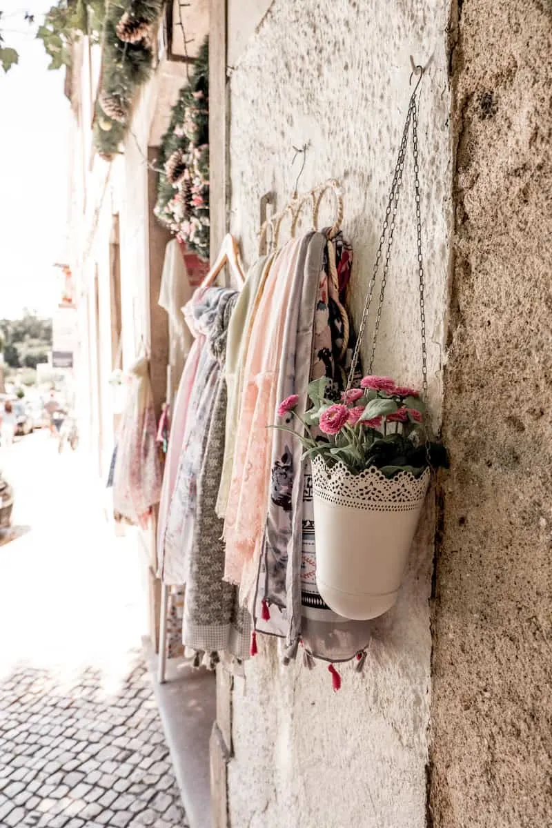 storing scarves on a hanger outside 