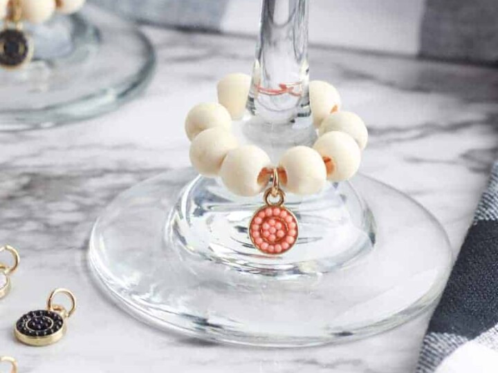 party drink charms on wine glasses on marble table