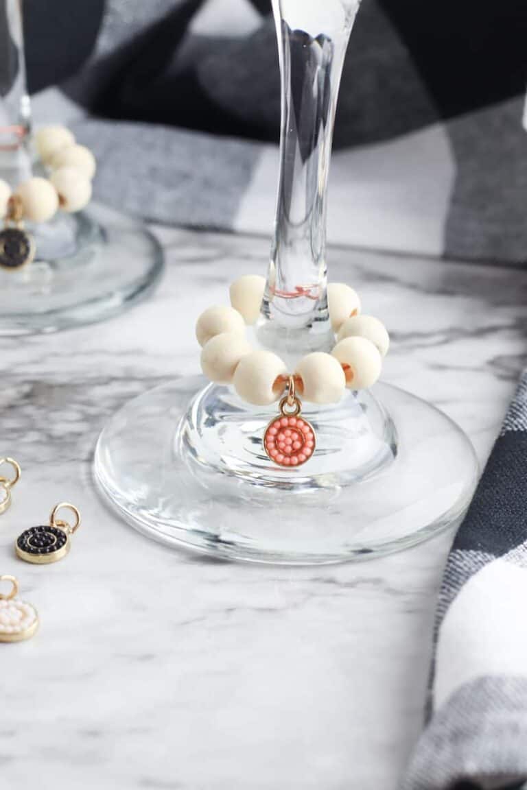 party drink charms on wine glasses on marble table