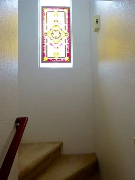 Stairwell window with stained glass