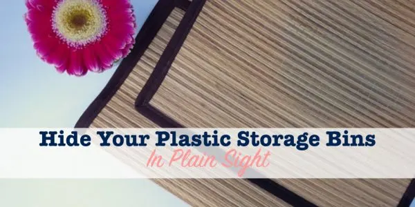 straw mat used to hide plastic storage bins in plain sight