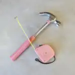 pink hammer and measuring tape