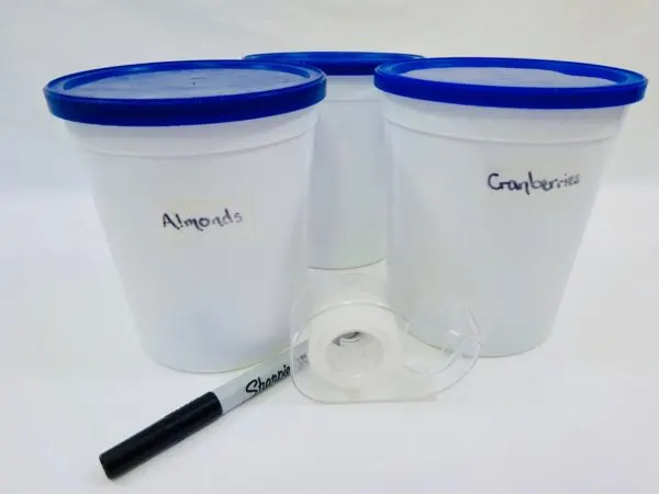 Keep your kitchen containers organized with labels written on clear tape
