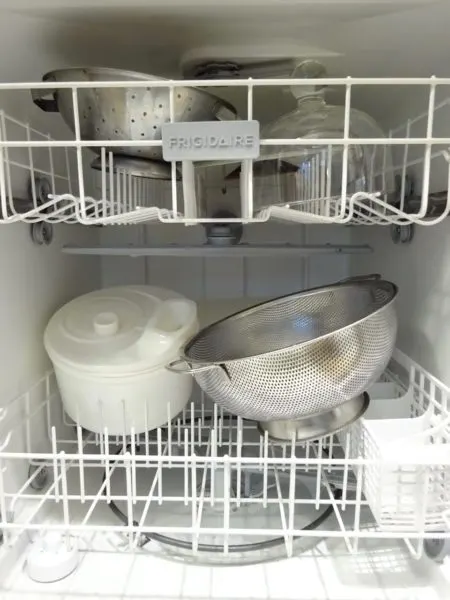 Large items stored in the dishwasher help keep the kitchen organized.