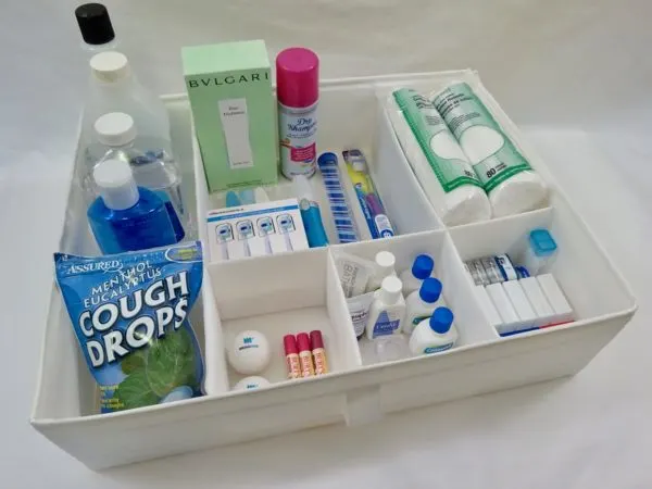 Use a drawer organizer to store toiletries neatly in a linen closet.