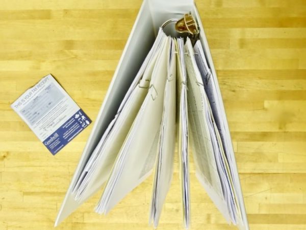 Office paperwork organized in a binder