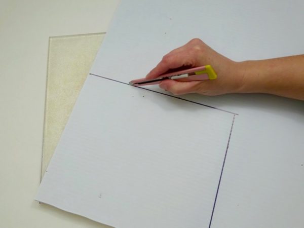 cutting out a piece of what plastic board