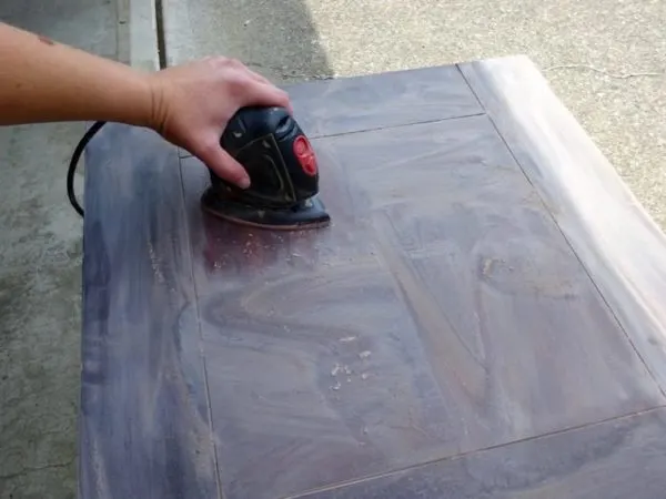 Sand and refinish a damaged wood table