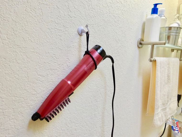 Hair dryer hanging on wall