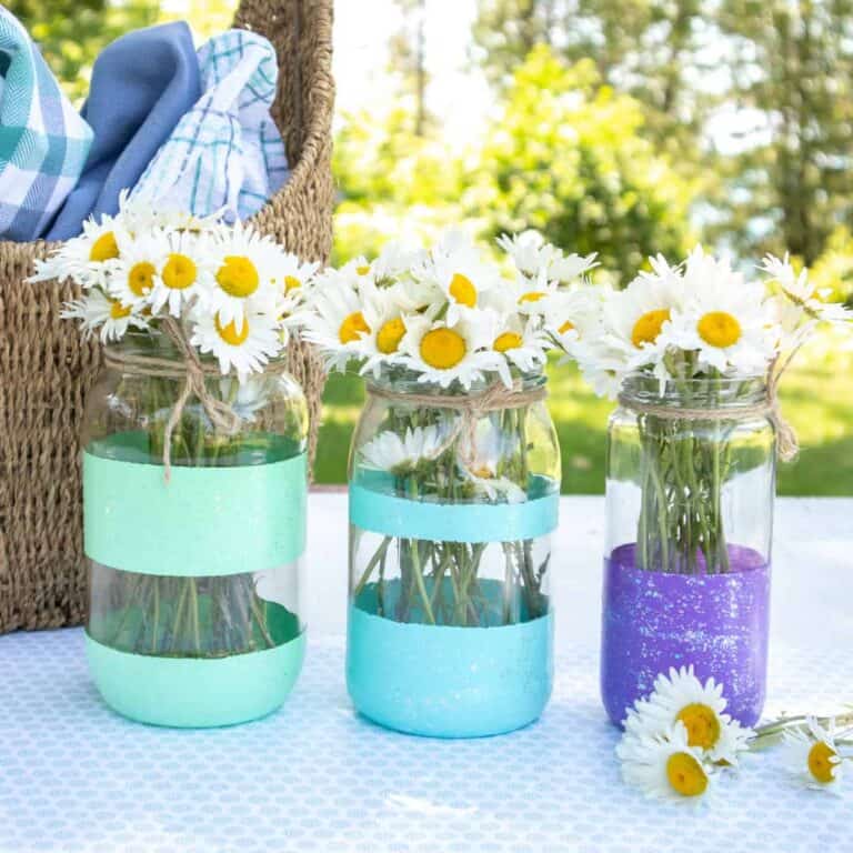 painted mason jars with acrylic paint stripes full of daisies