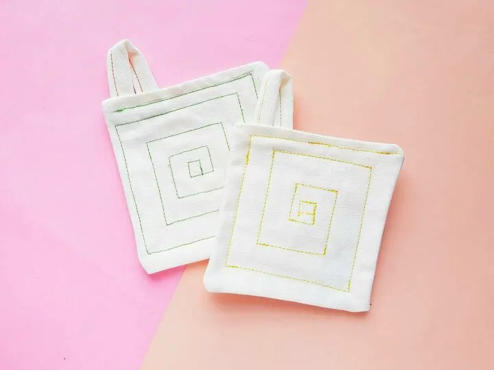drop cloth pot holders against pink background