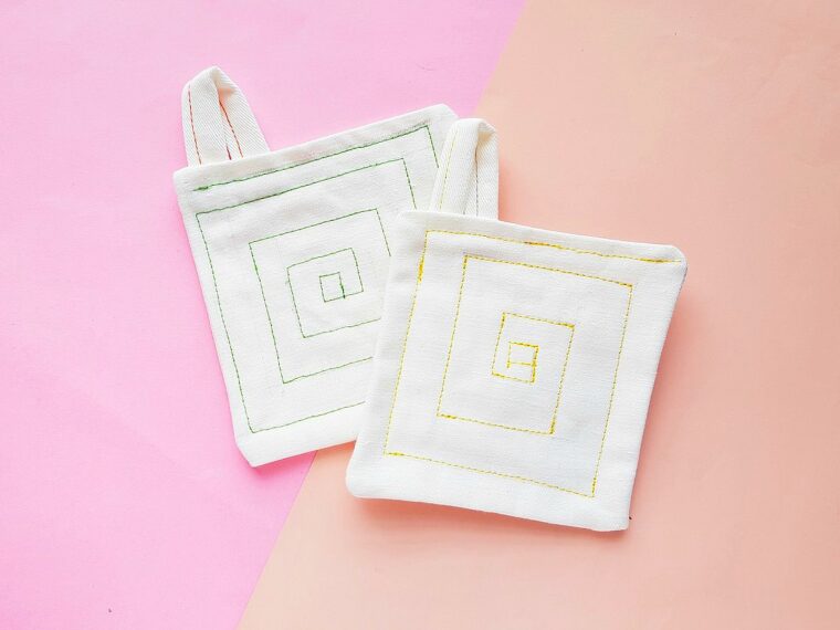 drop cloth pot holders against pink background