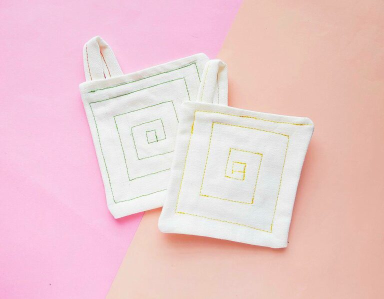 drop cloth pot holders against pink background