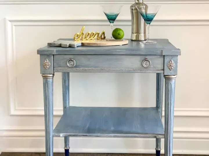 upcycled thrift store end table with cocktail glasses