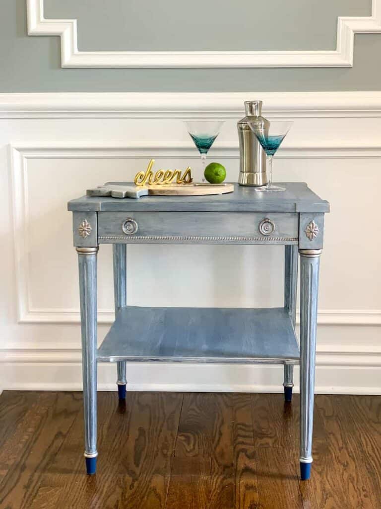 upcycled thrift store end table with cocktail glasses