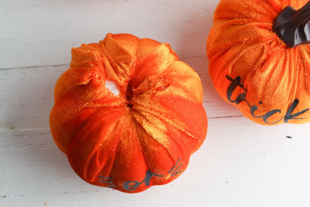 Applying plush fabric to dollar store pumpkins