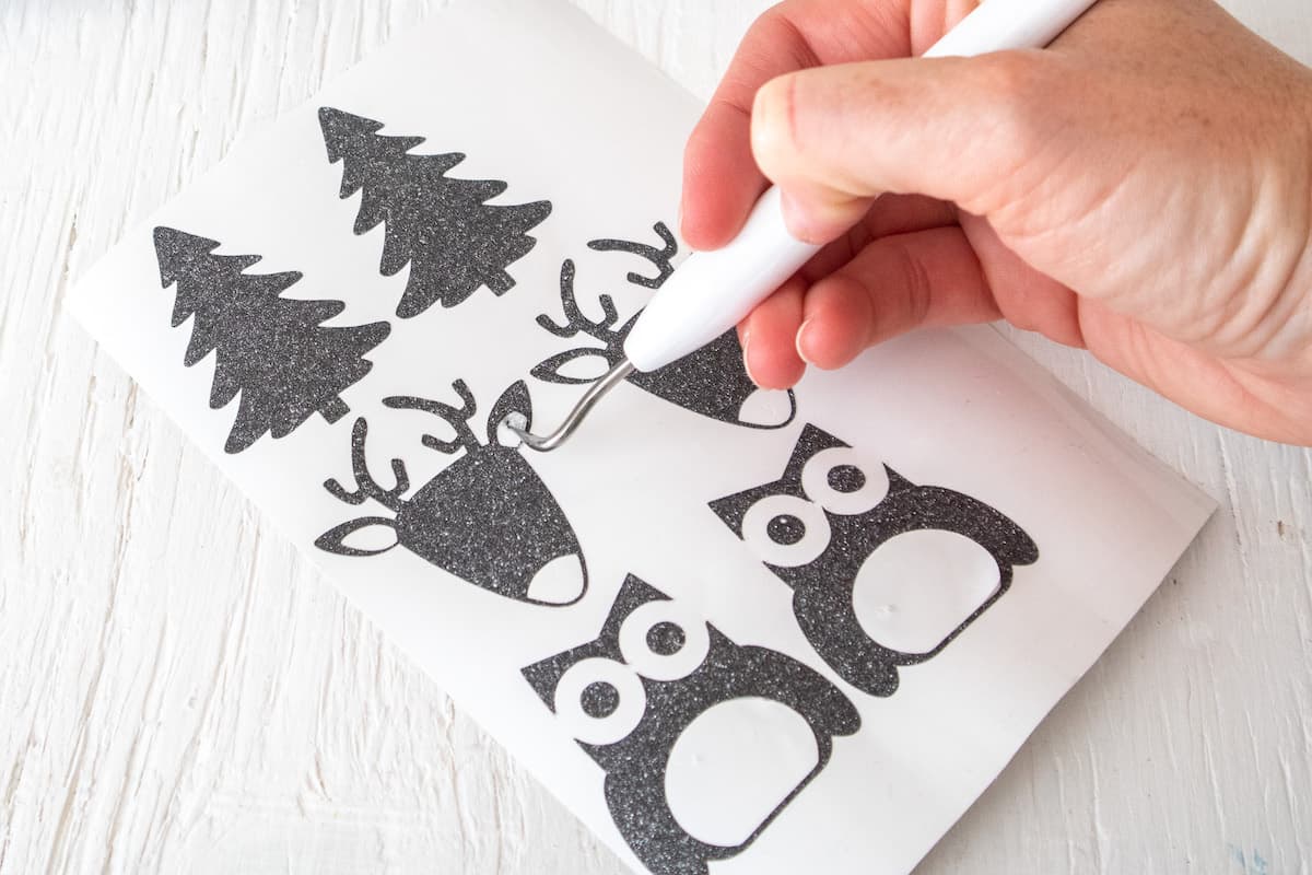 Cricut tool removing Glitter Vinyl Christmas stencils