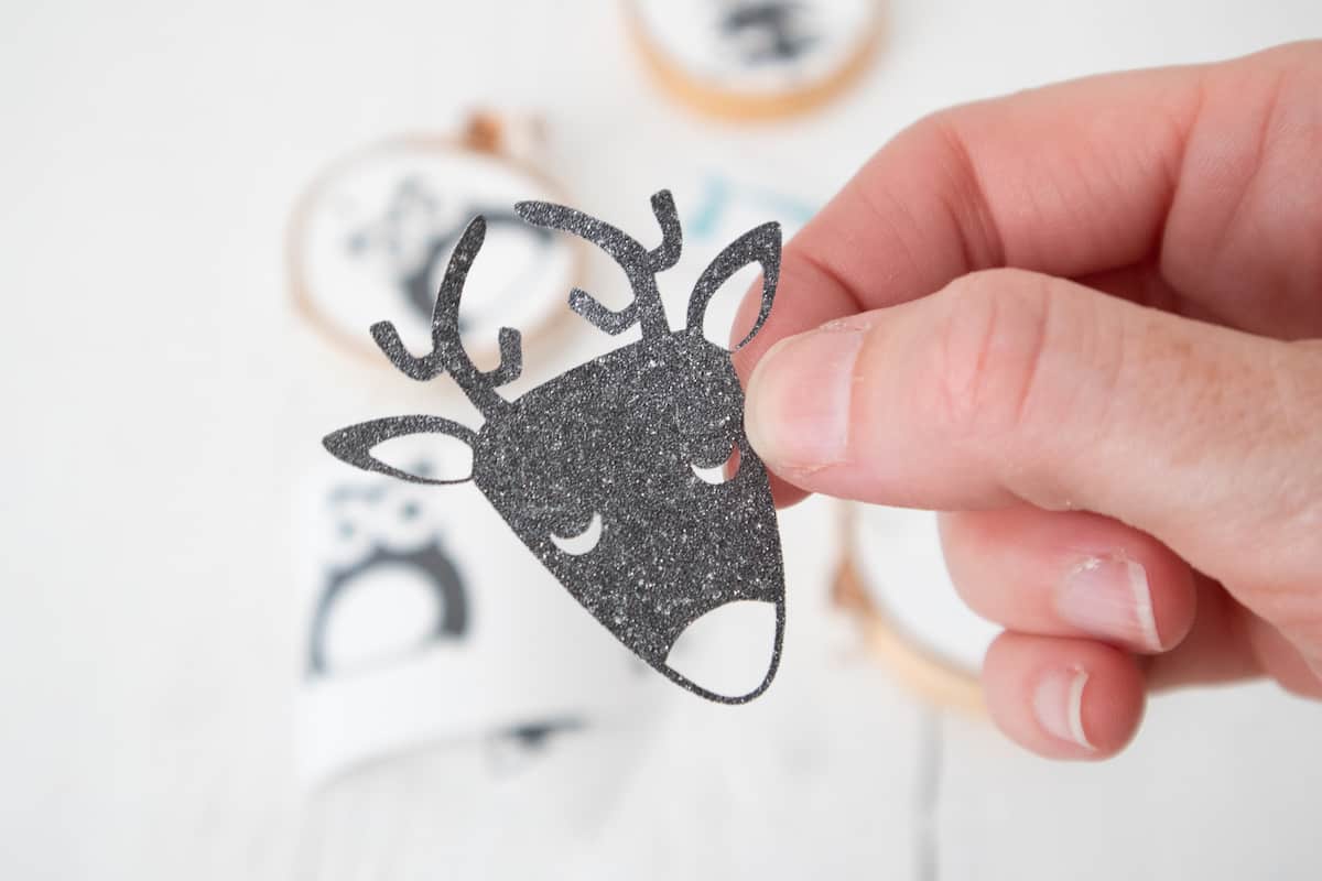 Glitter Vinyl reindeer head stencil in hand