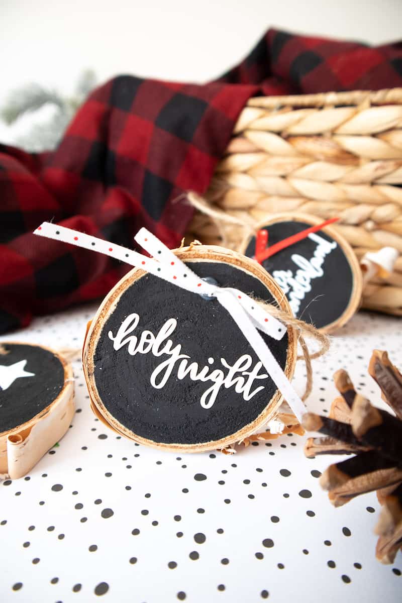Lettered wood slice ornament with twine and fabric bows
