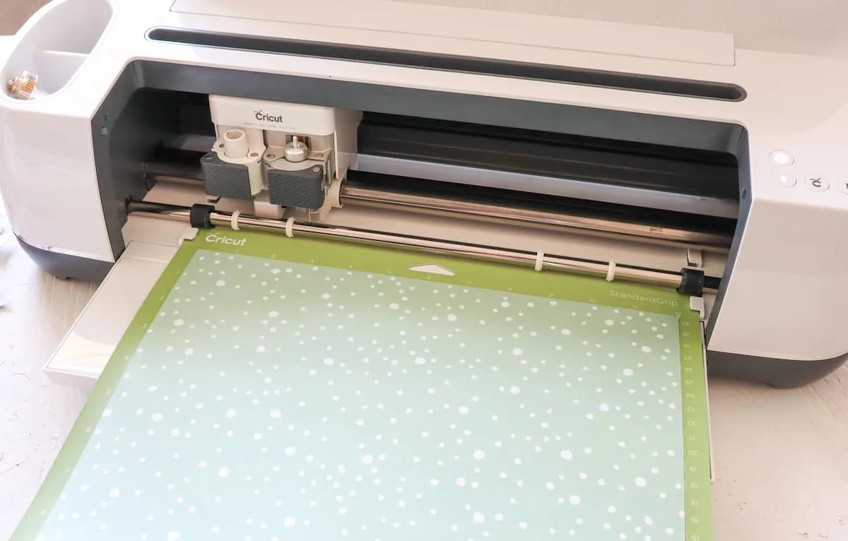 Cricut machine with holiday paper sheet