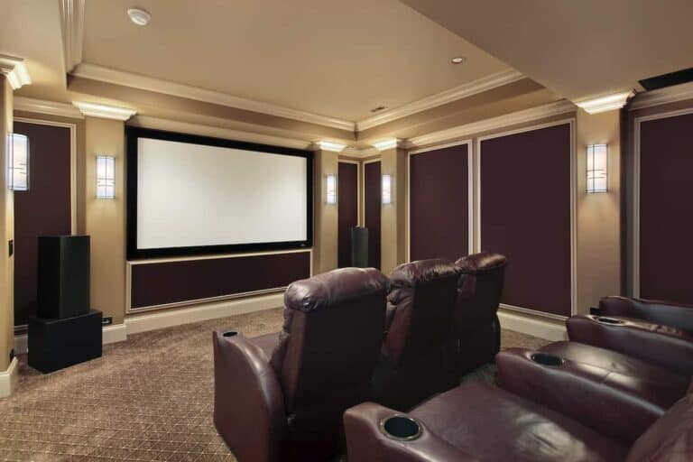 Theater room in luxury home with lounge chairs