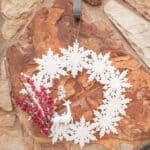 snowflake and deer Christmas Wreath on rock wall