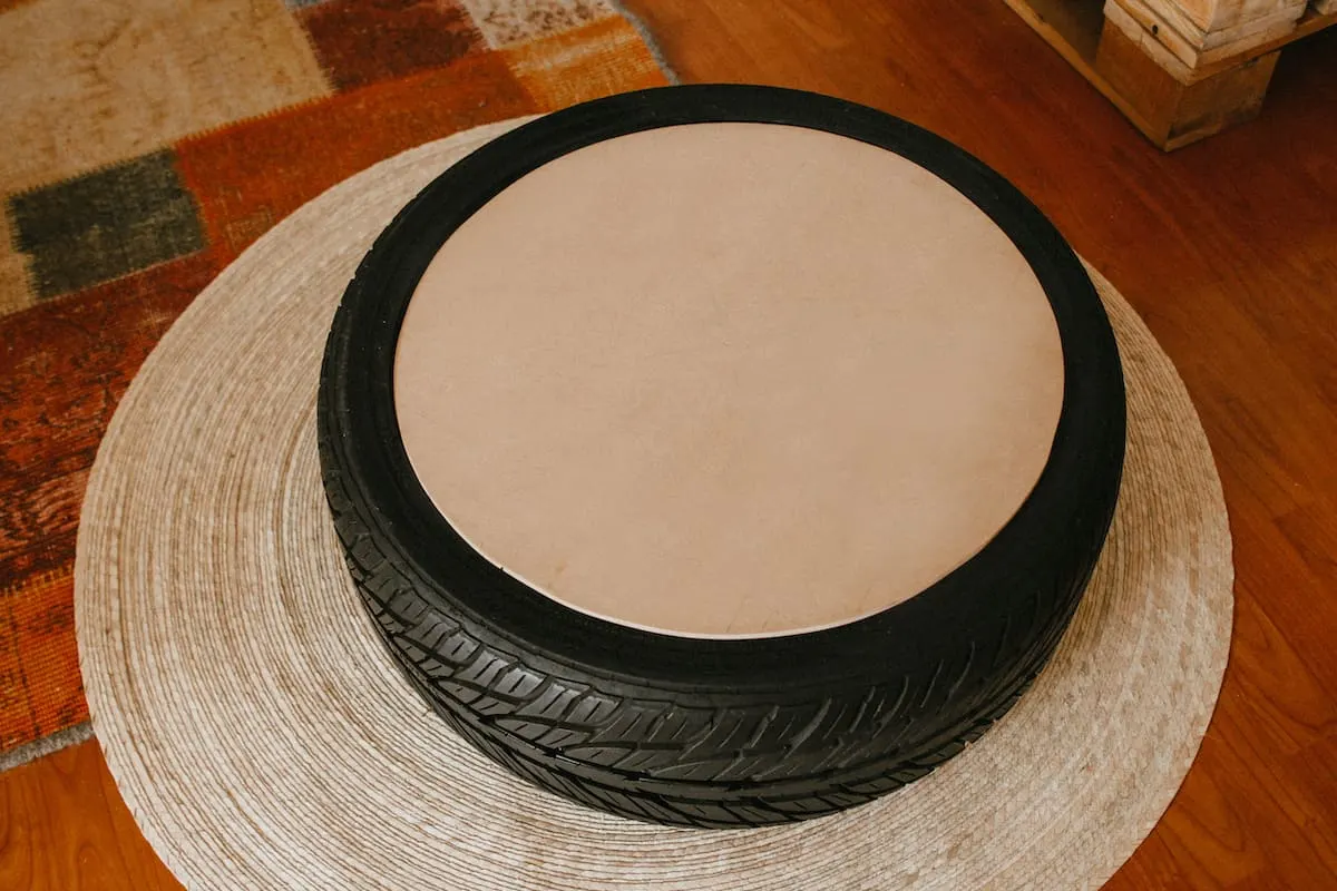 piece of wood on top of tire