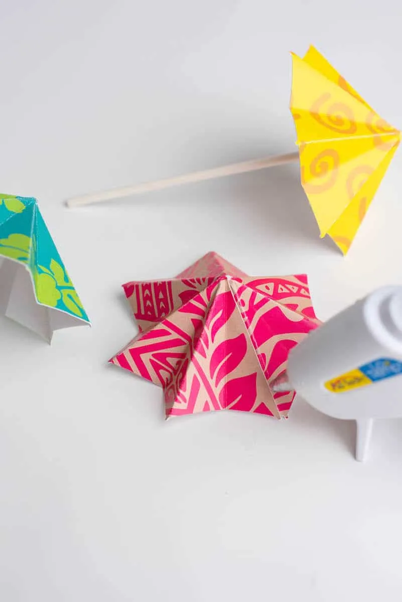 Hot glueing DIY drink umbrellas