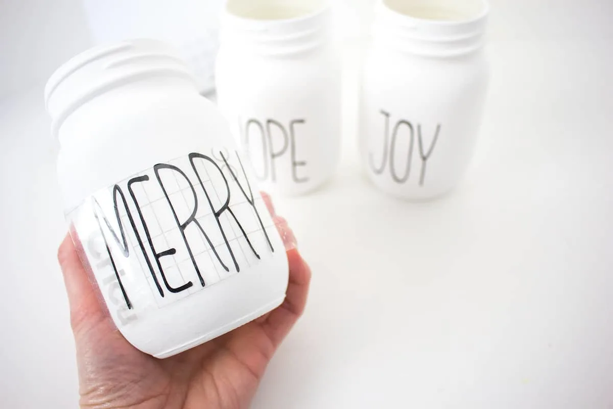 Merry vinyl letters on mason jar with transfer paper