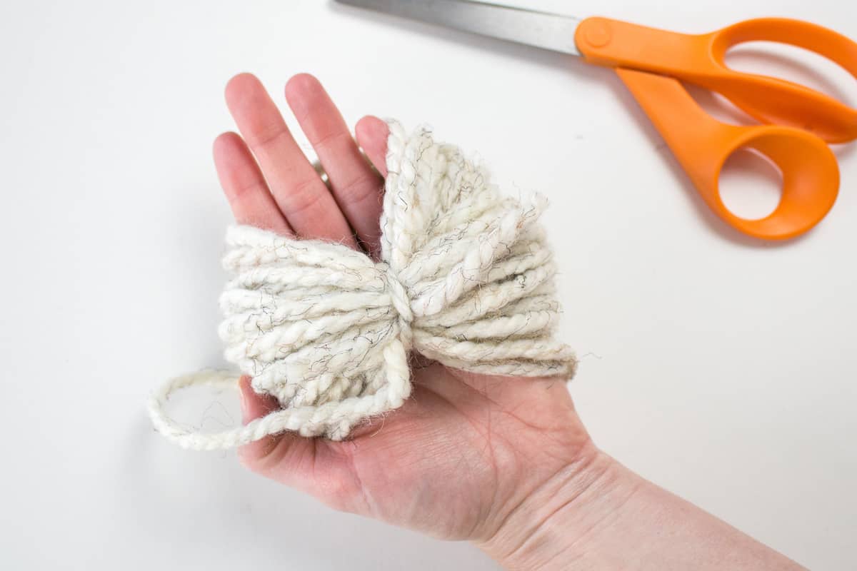 Tied Yarn for DIY in Hand and Scissors