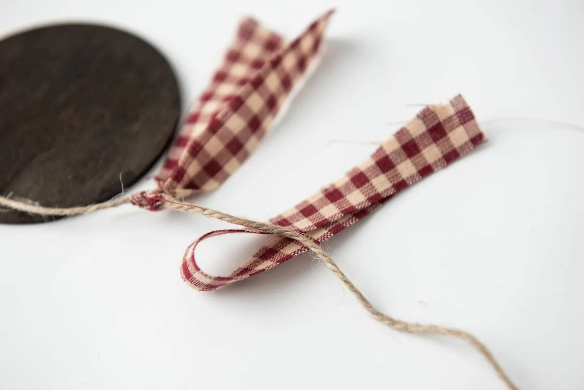 Tying Ribbon to Twine Banner