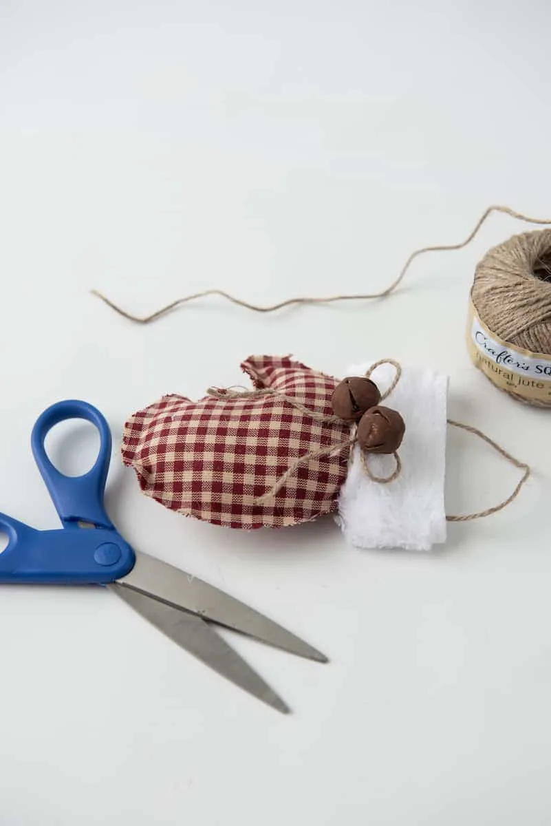 Tying Rustic Bells on to Ornament with Twine