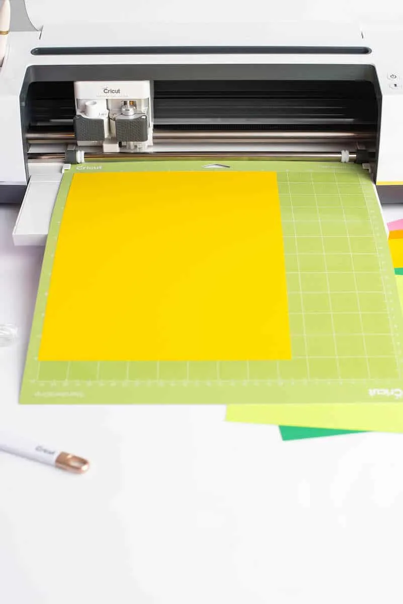 yellow paper on mat in Cricut Maker machine