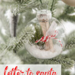 clear glass ornament with letter to Santa Claus inside