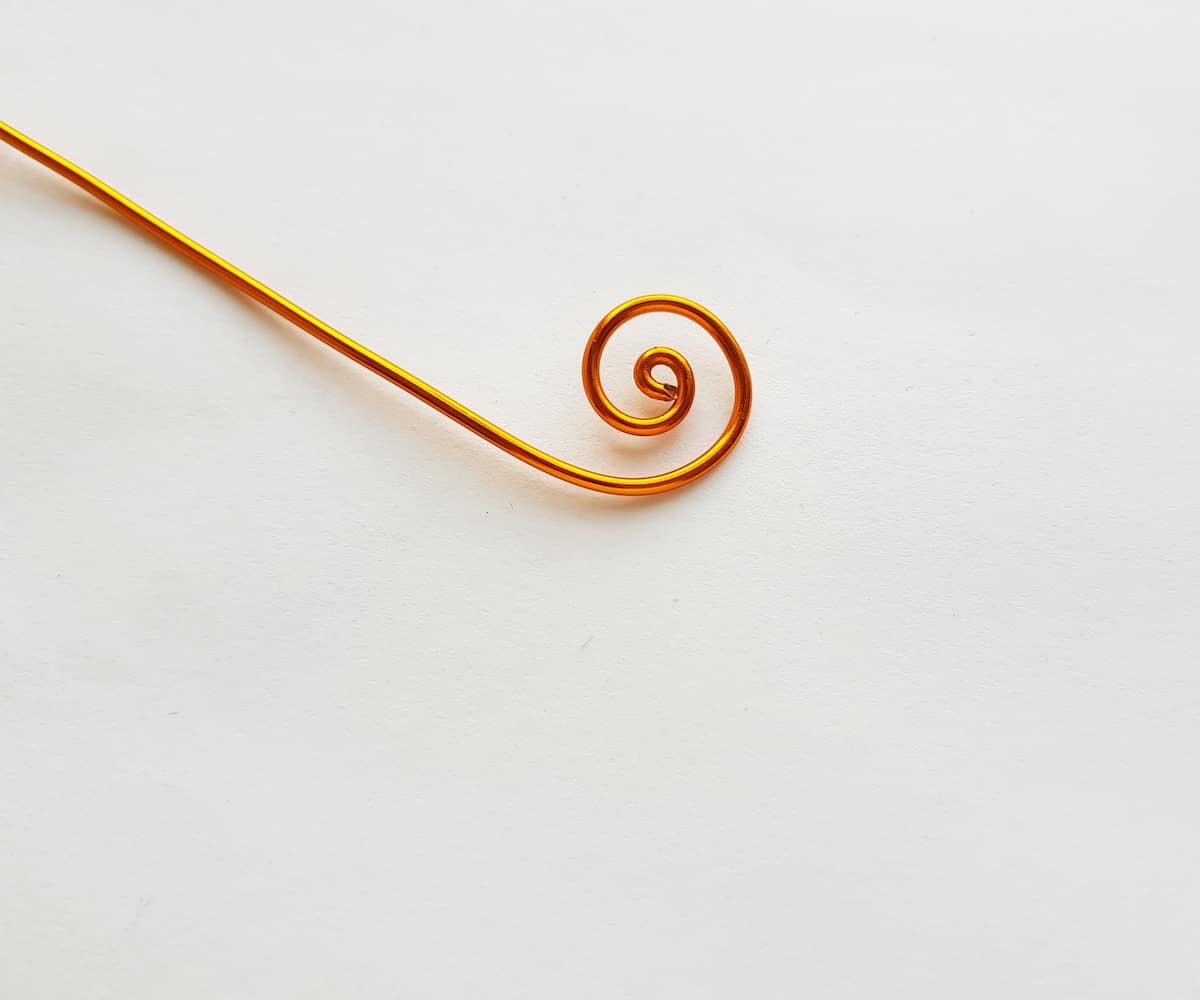 Curled wire for bookmark