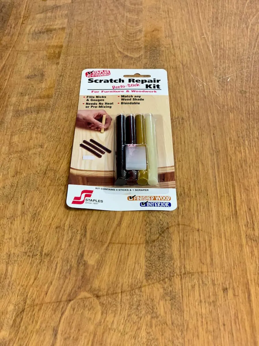 Wax table scratch repair kit on wooden table