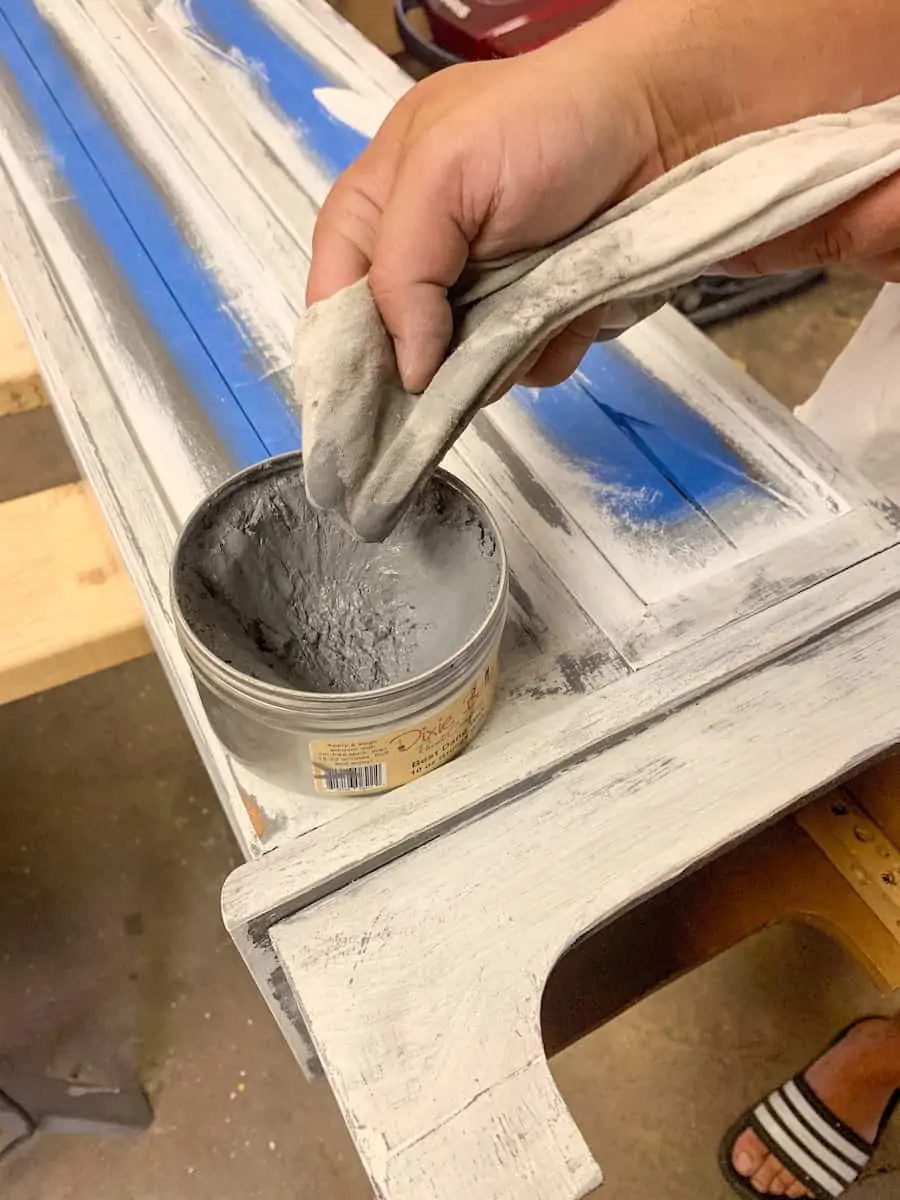 Wiping gray paint to distress furniture