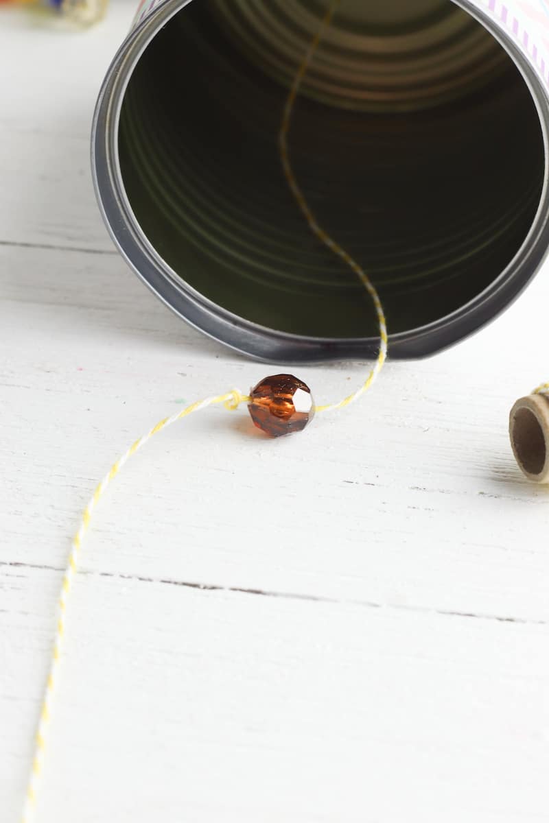 bead on string in DIY wind chime