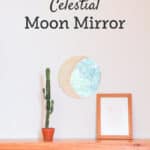 celestial moon mirror hanging on wall over desk