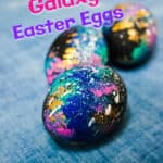 three galaxy Easter eggs on blue background