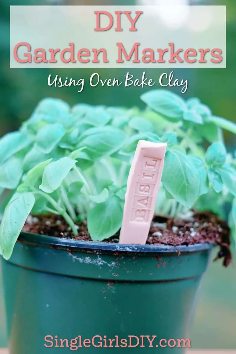 clay plant marker in a basil plant