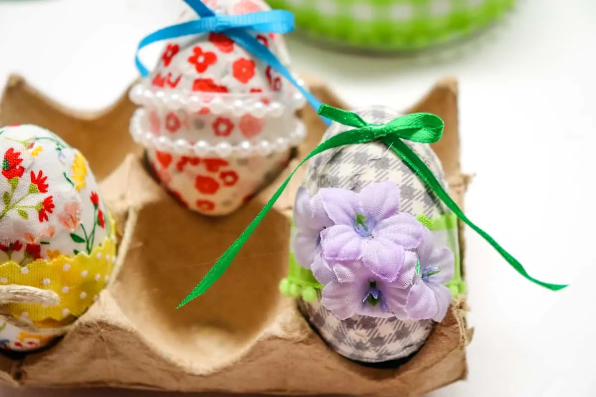 Decoupage Easter Eggs in brown cardboard egg holder