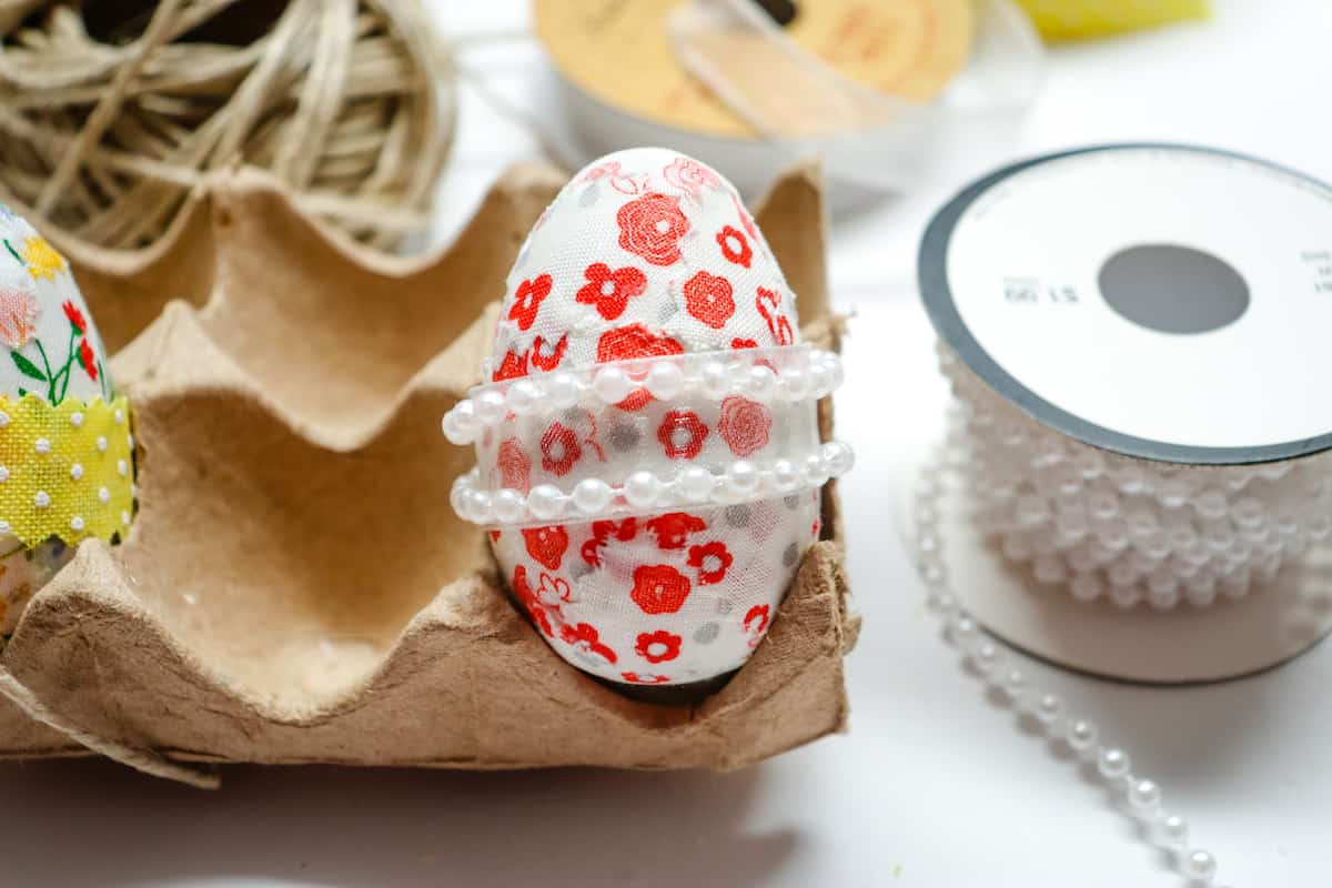 pearl ribbon around fabric covered egg