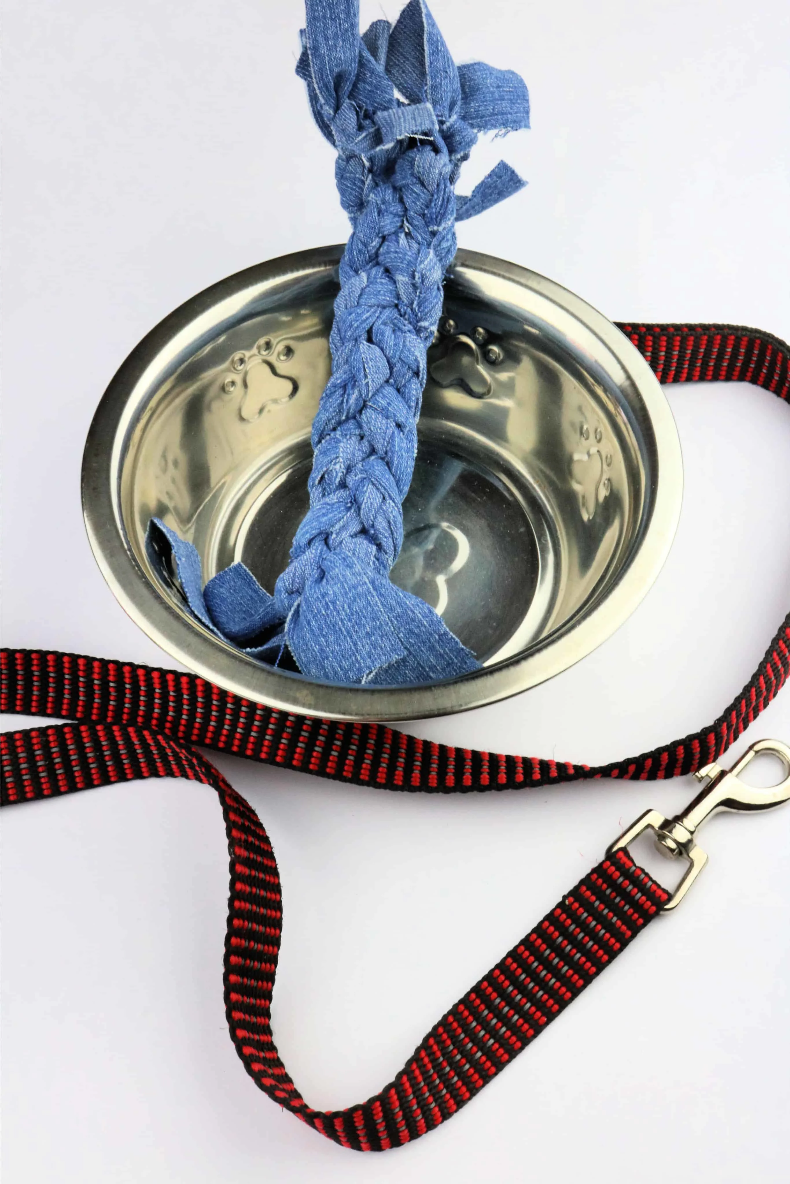 Denim Dog Toy in water bowl with leash