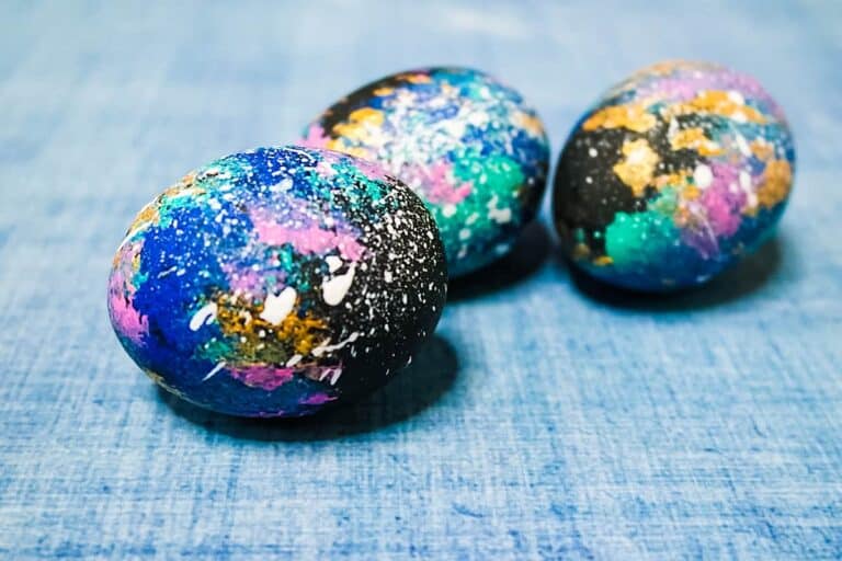 Galaxy Easter eggs on light blue background