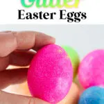 A hand holding a pink, DIY glitter-coated Easter egg with text overhead explaining "how to make glitter Easter eggs.