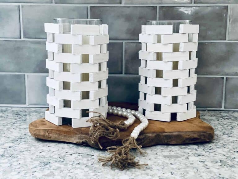 Jenga blocks DIY candle holder on grey background