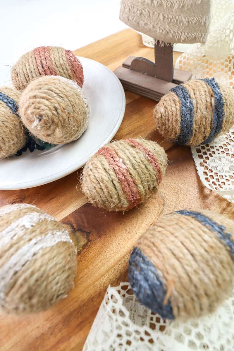 colorful Twine Wrapped Easter Eggs on table top